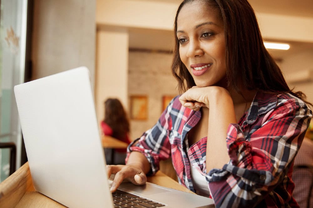 PHR® candidate studies on laptop. HR professional development and career growth.