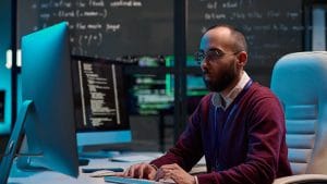 Java Data Structures and Algorithms: Programmer coding on computer. Software development, data analysis.