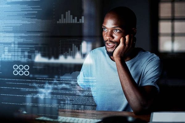 CISA professional analyzing data. Certified Information Systems Auditor examining charts and code.