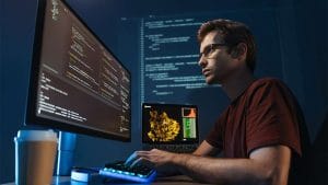 CompTIA Cloud+ candidate coding. IT professional working on cloud technology.